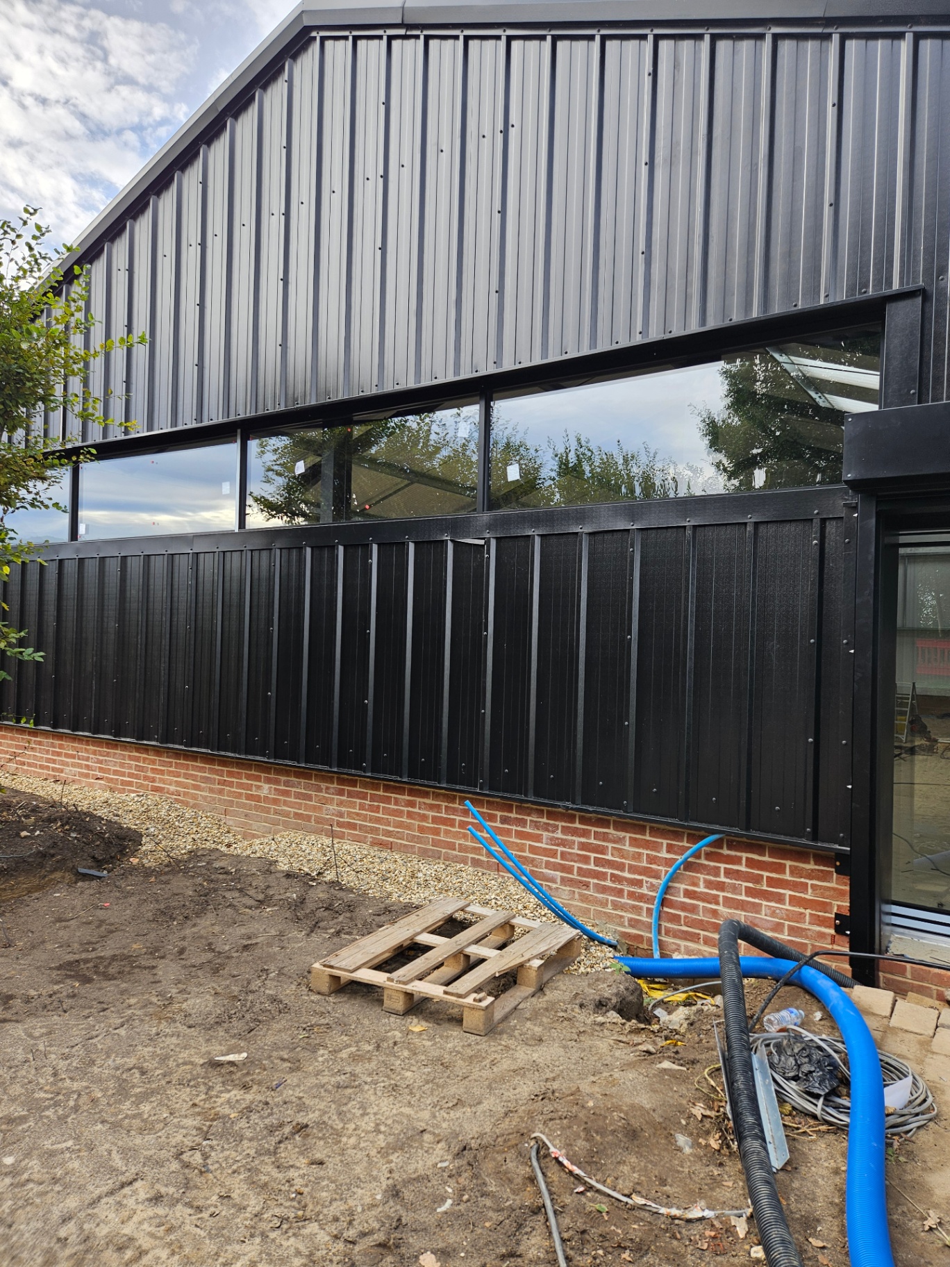 Algy's Norwich — aluminium curtain wall, shopfront and roller shutter installation – Prestige Aluminium Systems