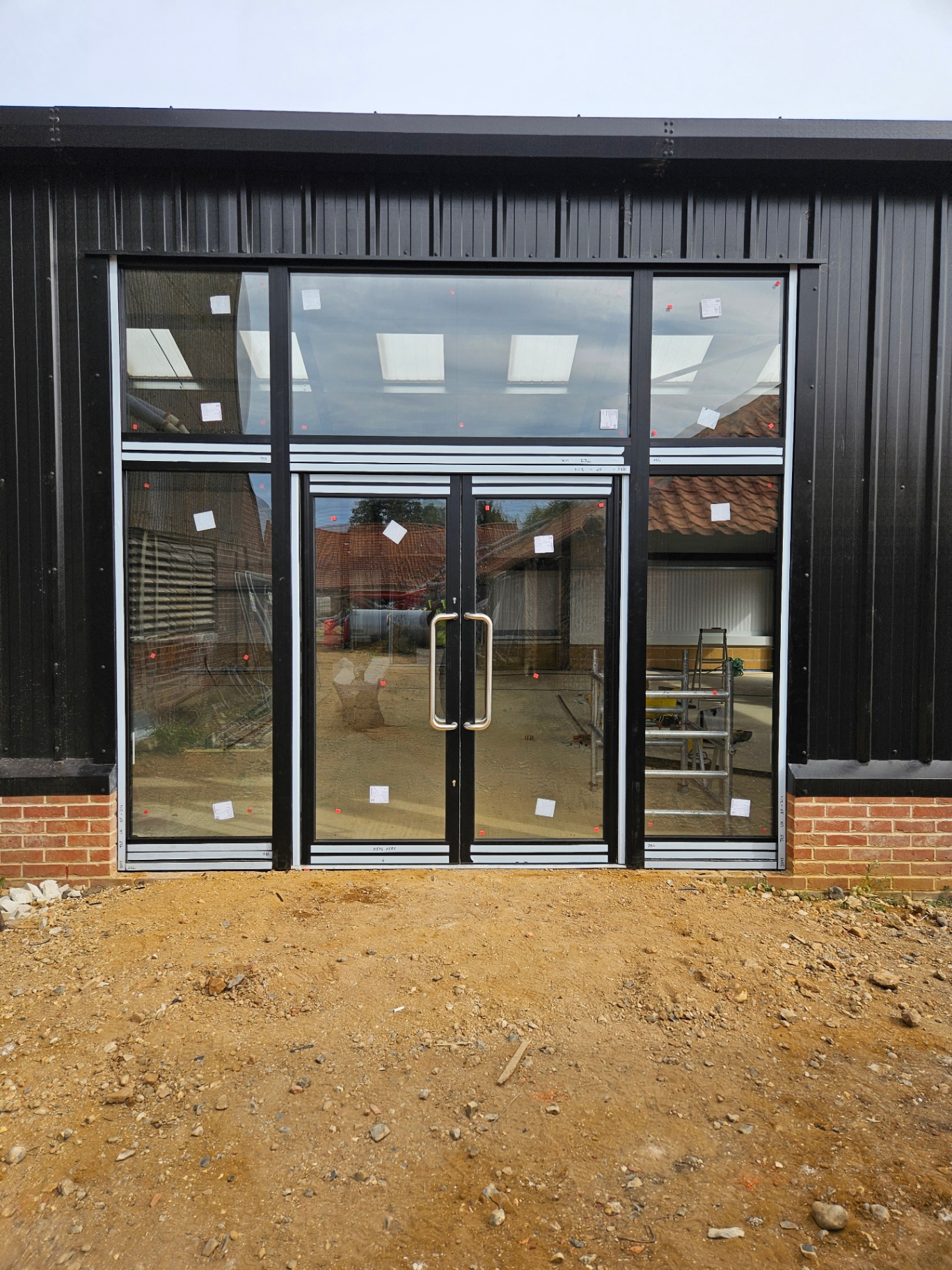 Algy's Norwich — aluminium curtain wall, shopfront and roller shutter installation – Prestige Aluminium Systems