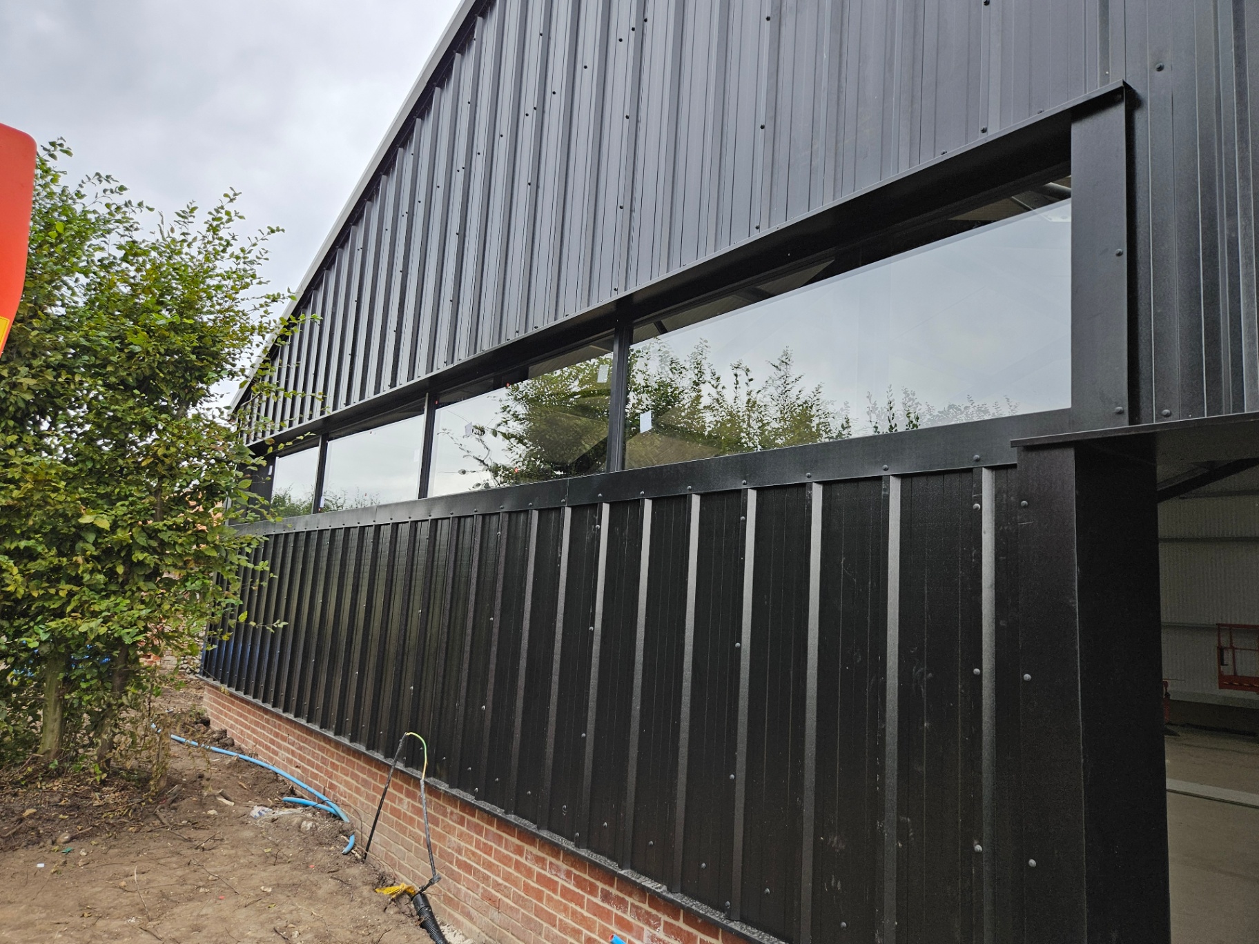 Algy's Norwich — aluminium curtain wall, shopfront and roller shutter installation – Prestige Aluminium Systems