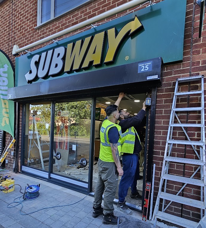 Commercial shopfront install at Subway with roller shutter housing – Prestige Aluminium Systems